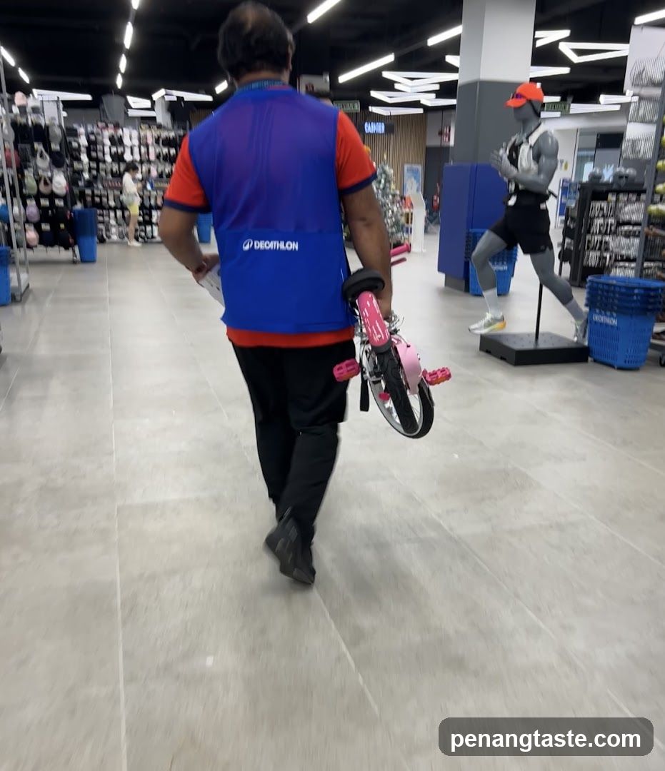 Store Interior with Employee Carrying Bicycle