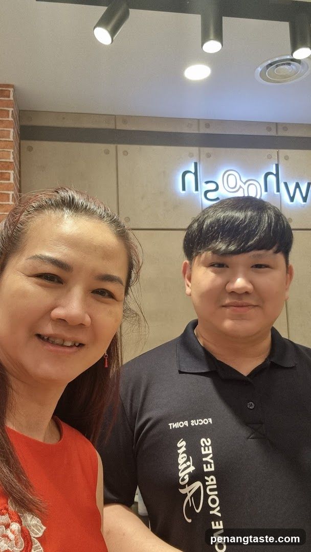 Two people posing for a photo