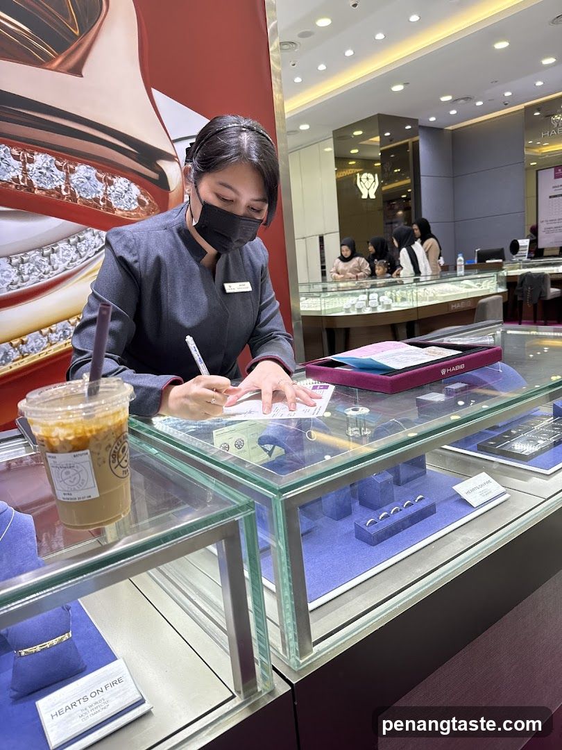 Jewelry store employee at counter