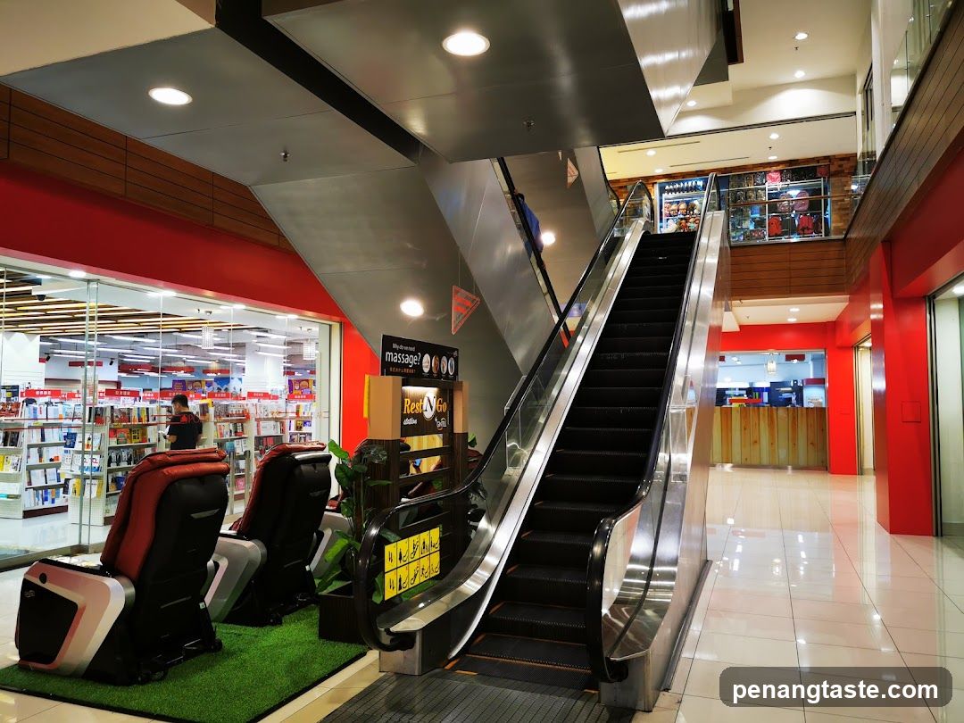 Mall Interior with Escalator and Massage Chairs