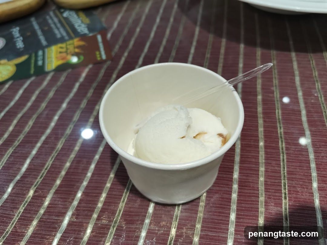 Ice cream in cup on striped tablecloth