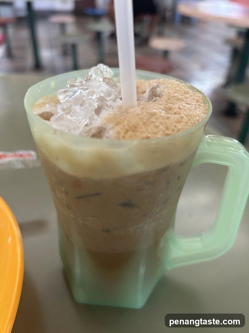 Iced beverage in a mug with straw