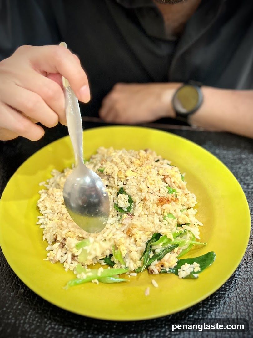 Person eating fried rice