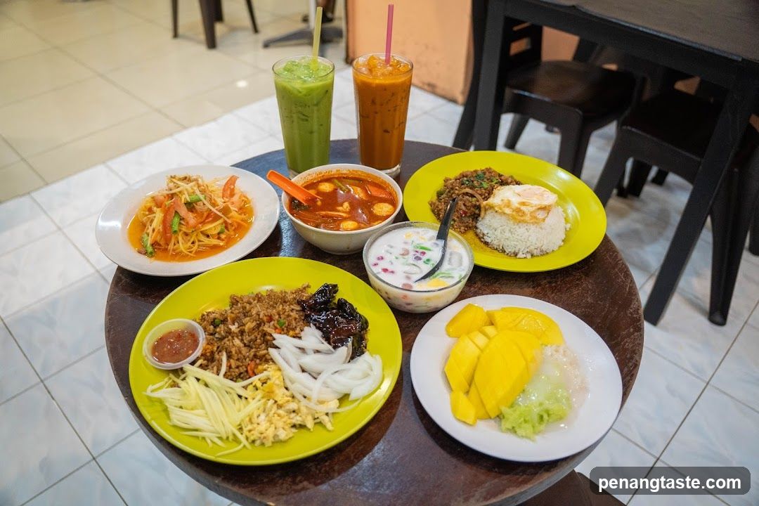 Table with Thai dishes and drinks