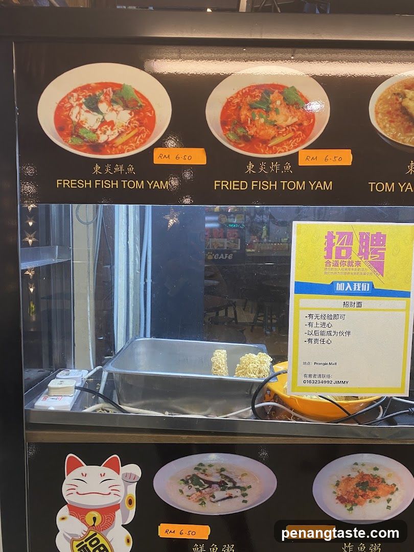 Food stall window display with hiring poster