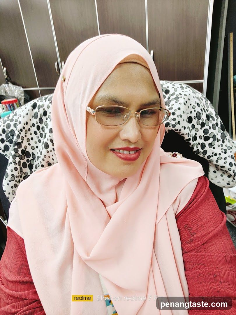 Portrait of a woman wearing hijab and glasses