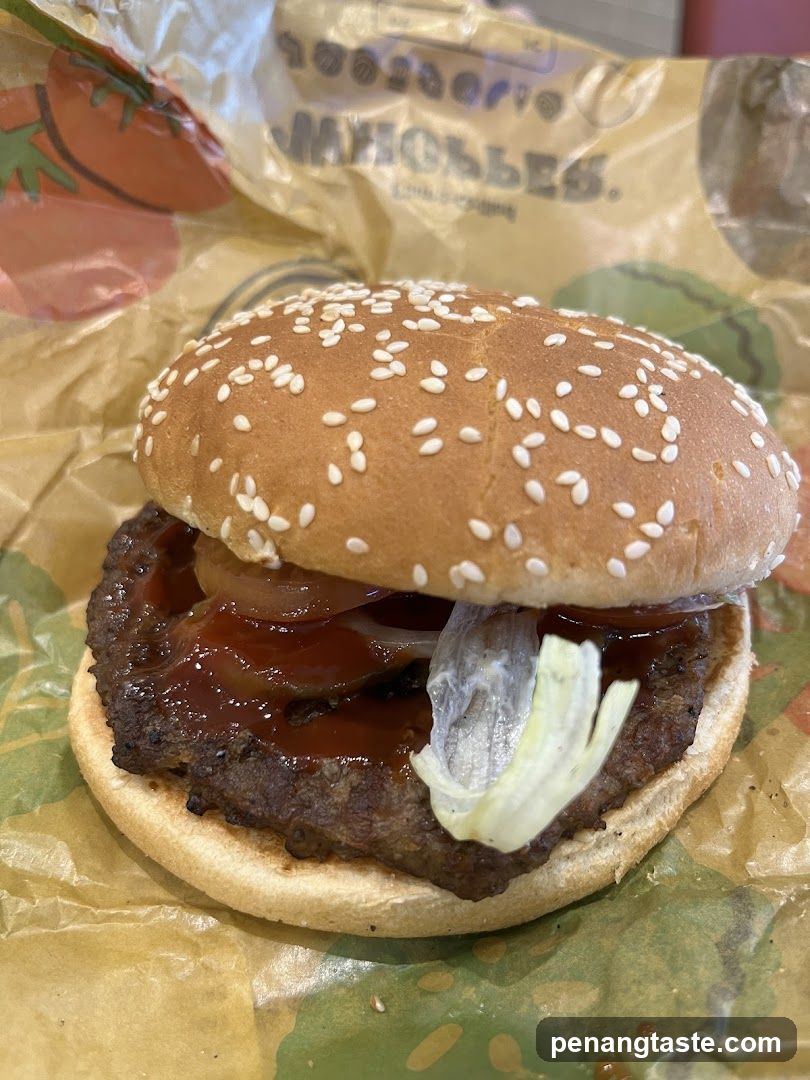 Burger on branded paper wrapper