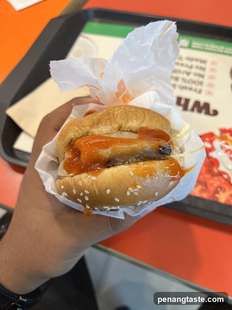 Hand holding burger