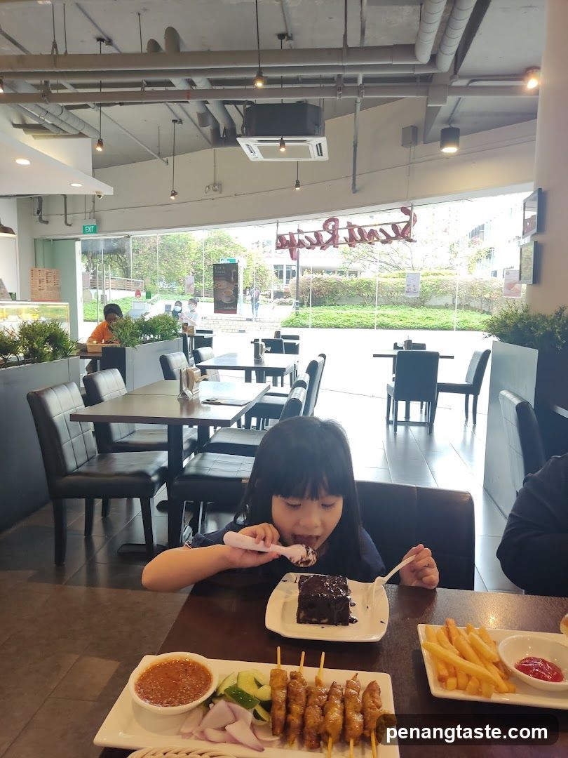 Child eating dessert in restaurant interior