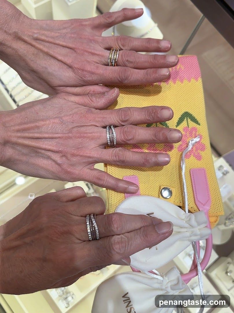 Hands with Rings Displayed Over Jewelry Bag