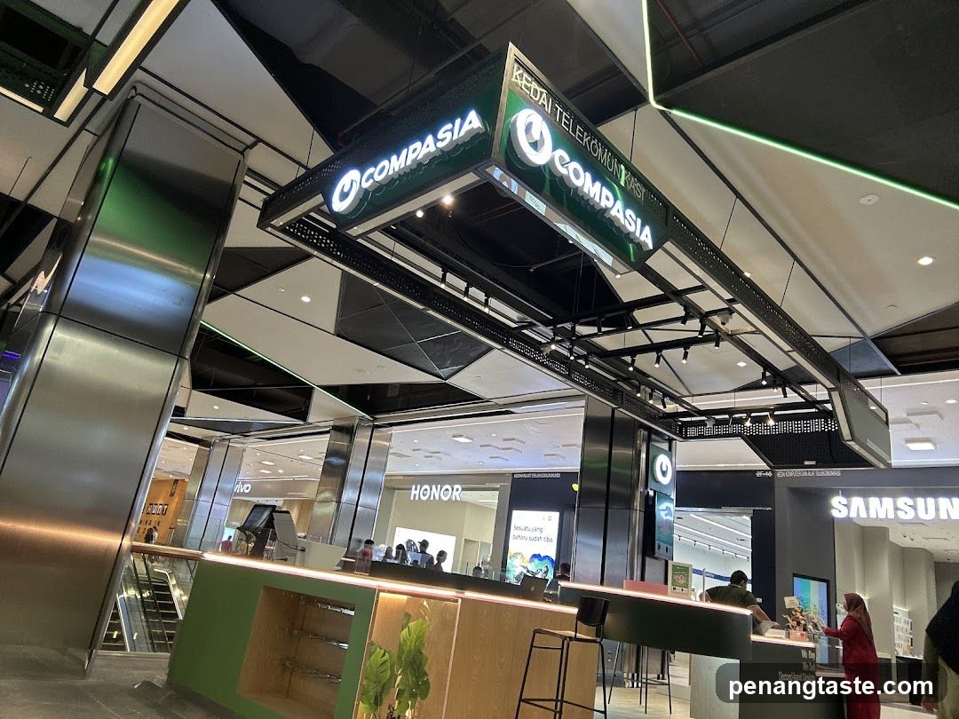 Interior of a shopping mall with telecom store signage