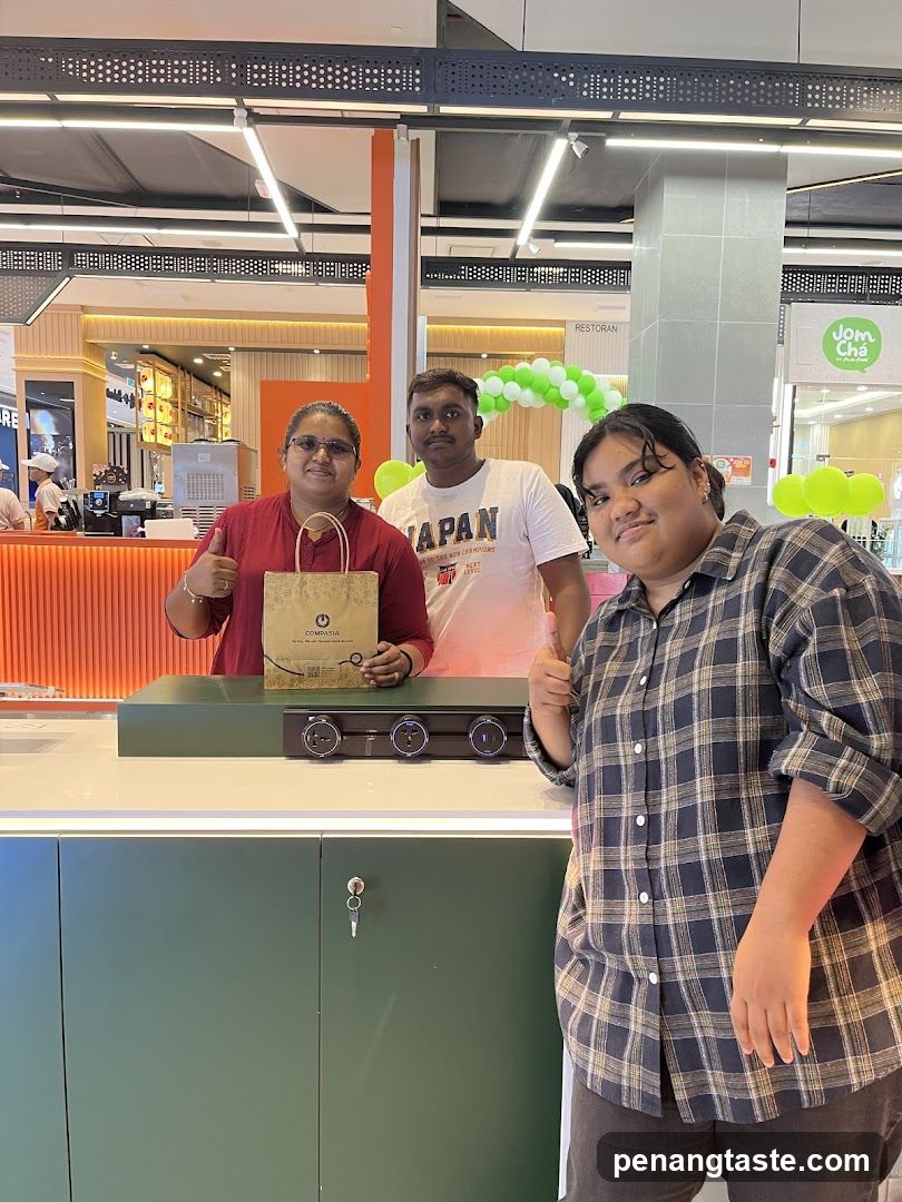 Three people posing in a shopping mall interior