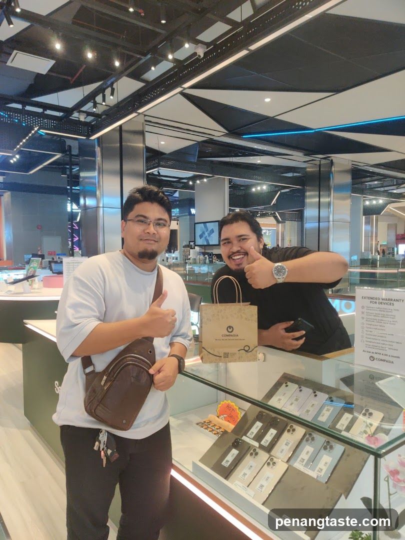 Two individuals in a tech store
