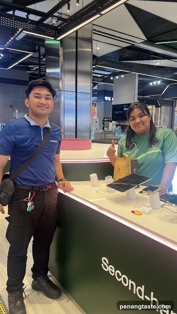 Two staff members at a retail counter