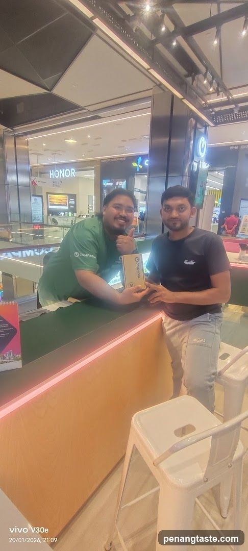Two individuals at a retail counter