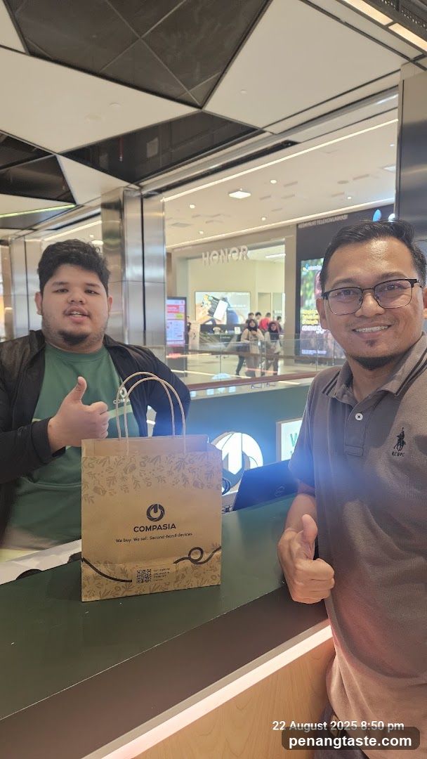 Two individuals at a retail counter