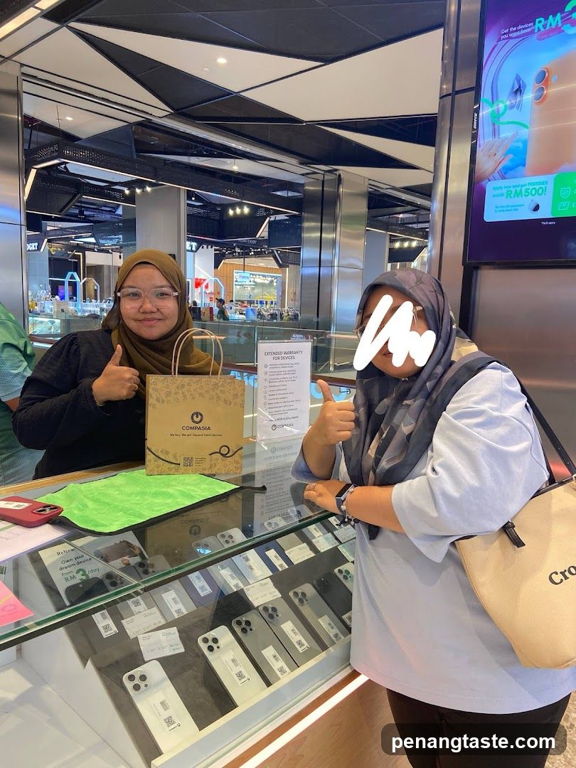 Two individuals at a retail counter
