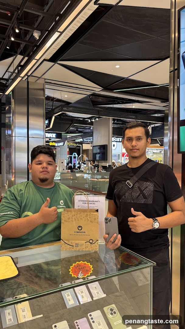 Two individuals at a retail counter