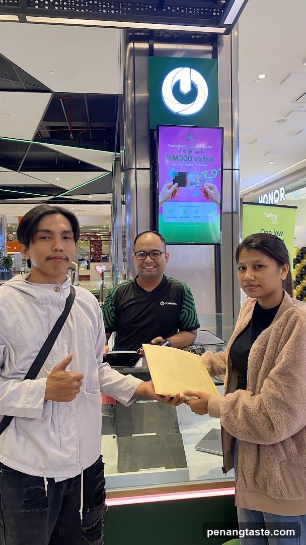 Three people at a store counter