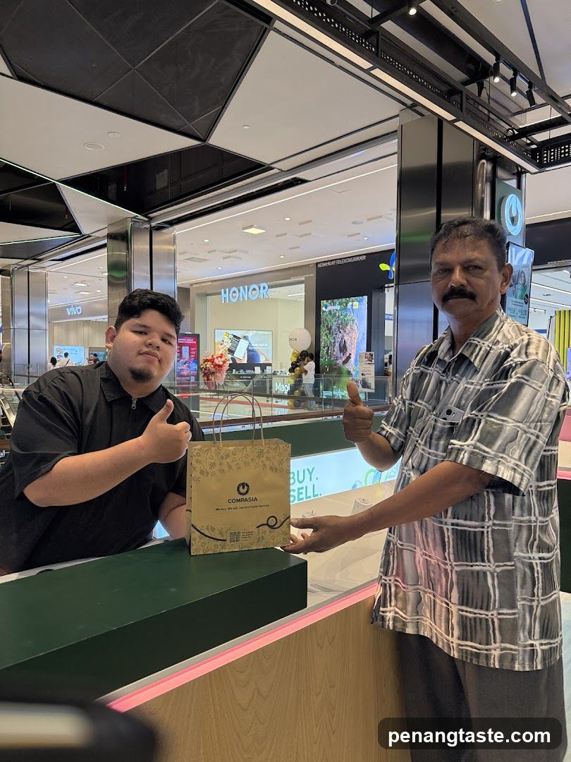 Two individuals at a retail counter