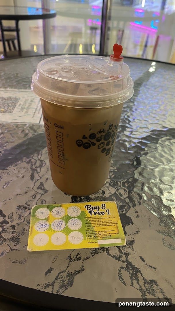 Coffee Cup with Promotional Card on Table