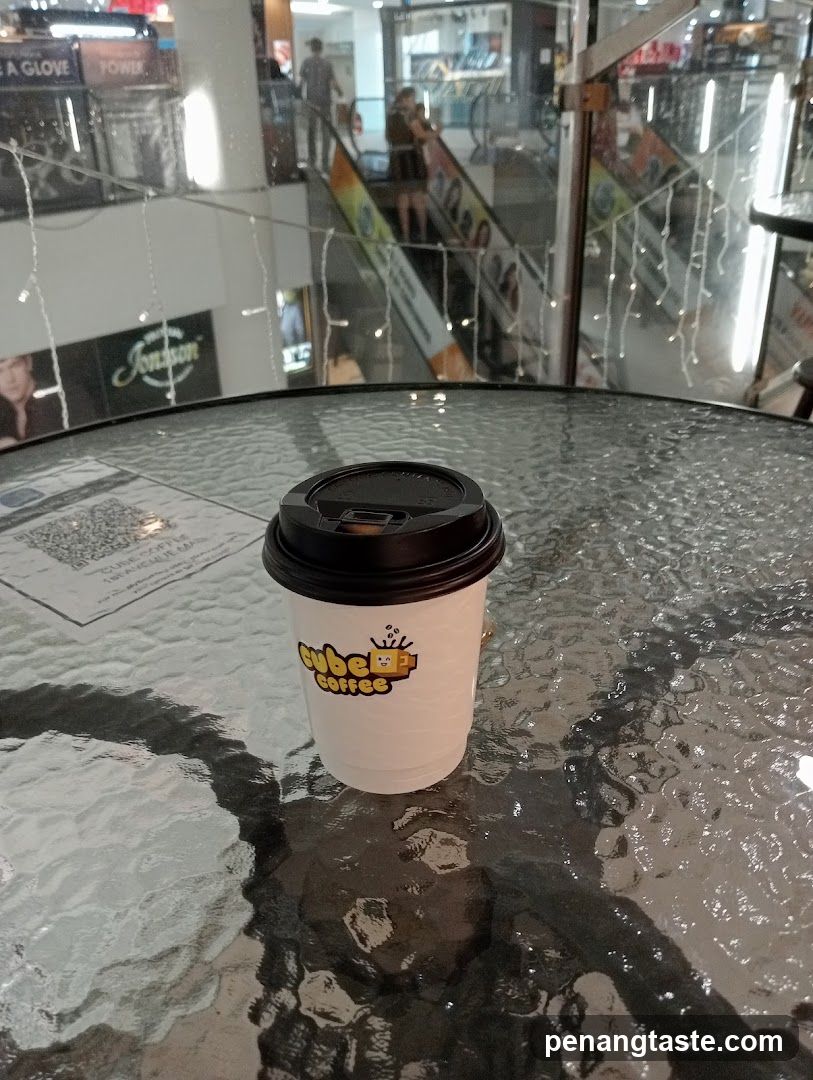 Coffee Cup on Glass Table in Mall Interior