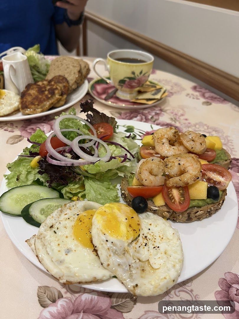 Breakfast Plate with Shrimp Toast, Fried Eggs, Salad, and Coffee