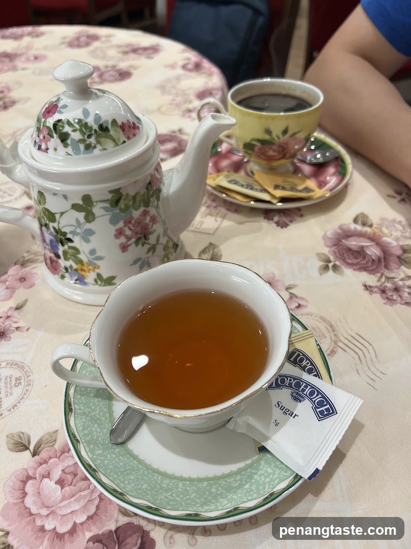 Tea set on floral tablecloth