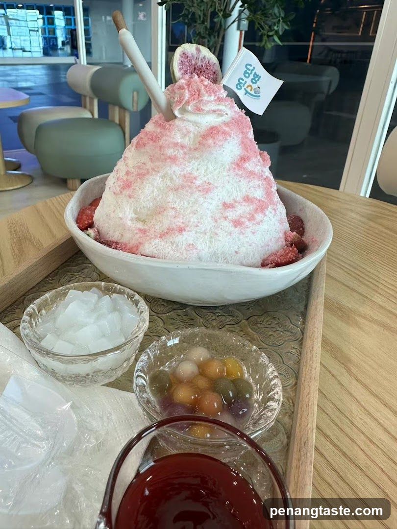 Bowl of shaved ice dessert with side dishes