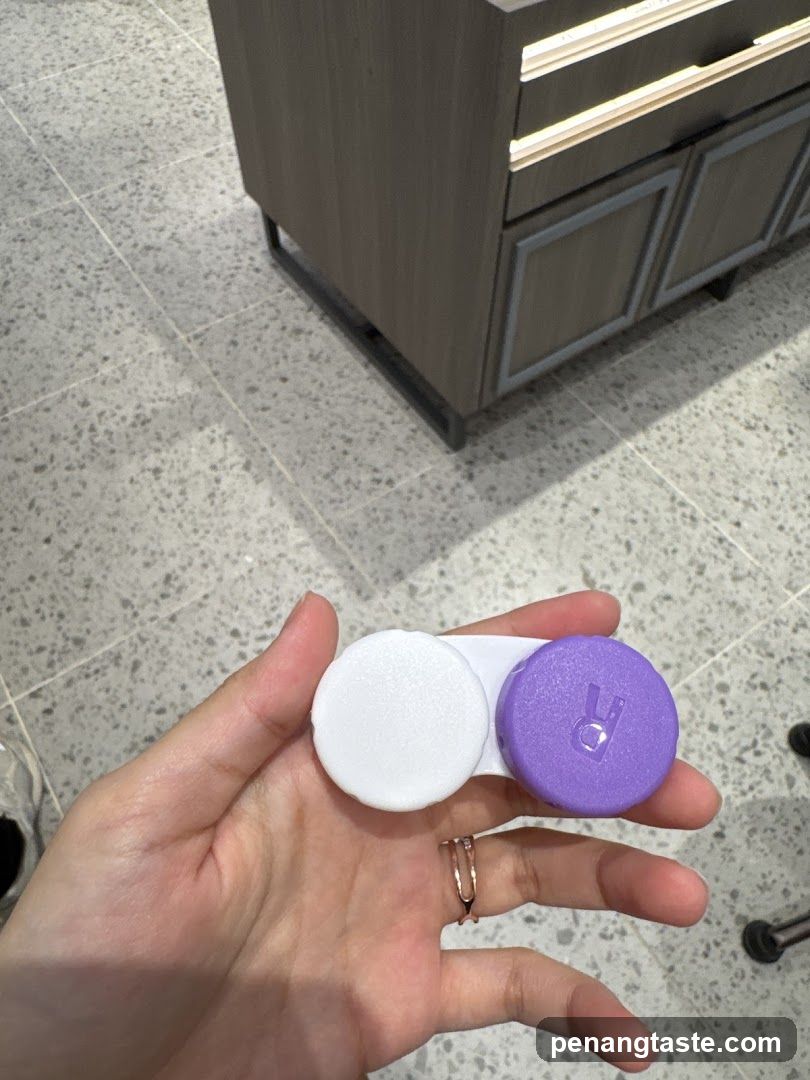 Hand holding contact lens case