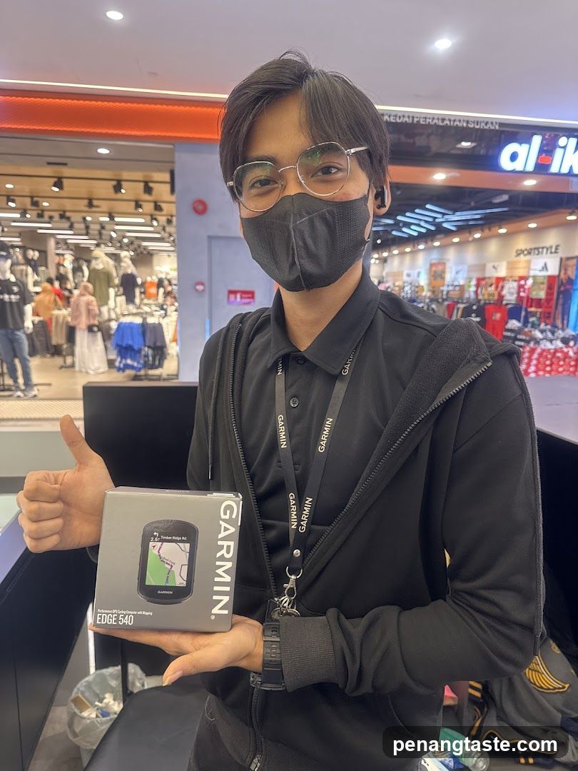 Person holding Garmin product in store