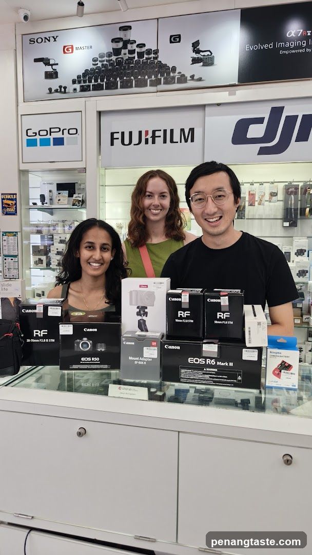 Three people in camera store
