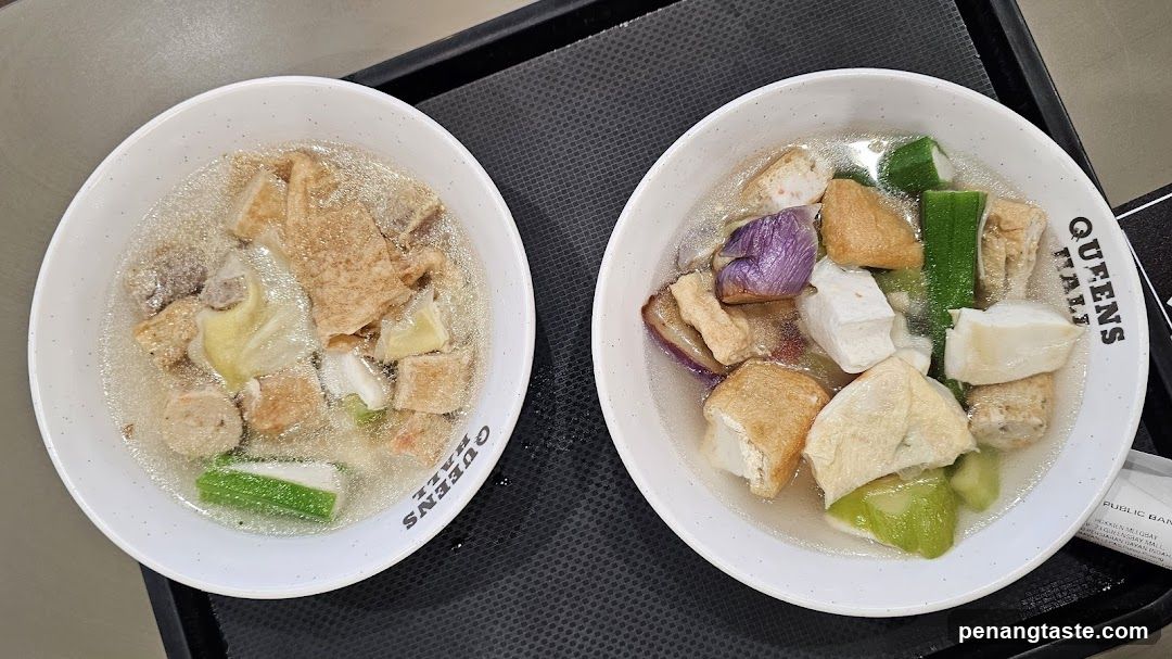 Two bowls of soup on a tray