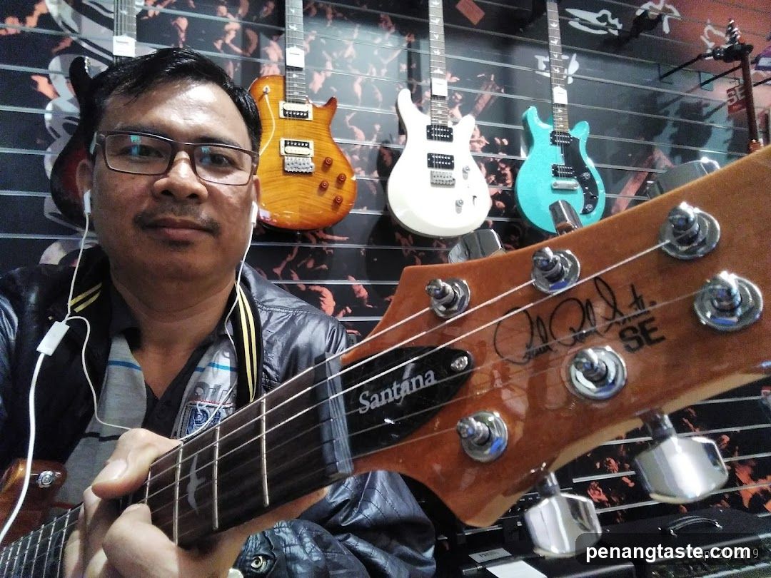 Man holding a guitar