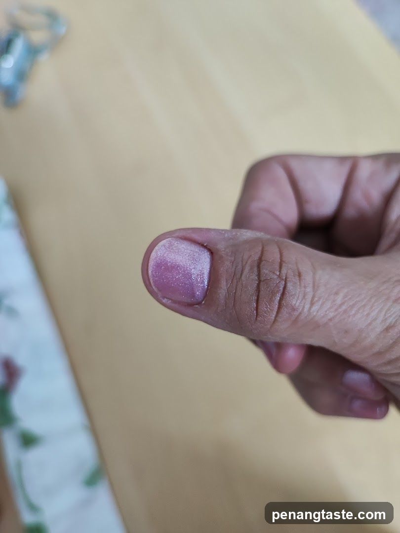 Hand with painted nail