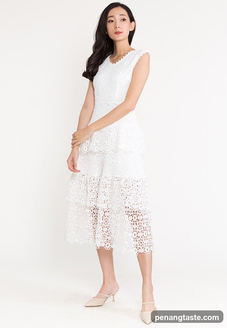 Model wearing white lace dress