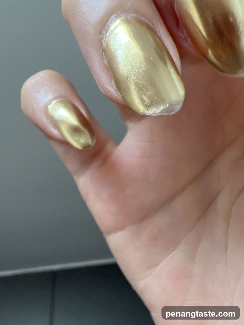 Hand with Gold Nail Polish