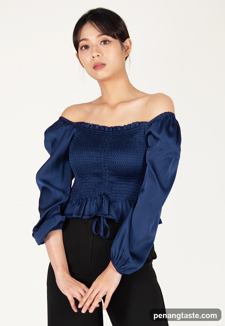 Model wearing off-shoulder blouse