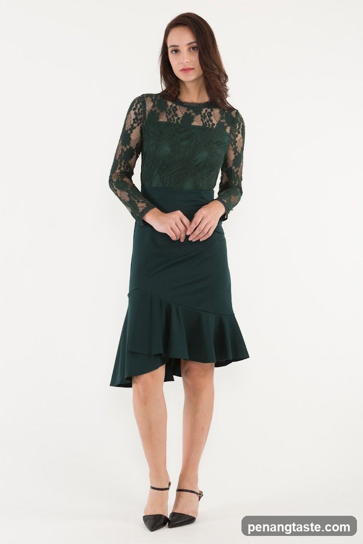 Model wearing a green lace dress