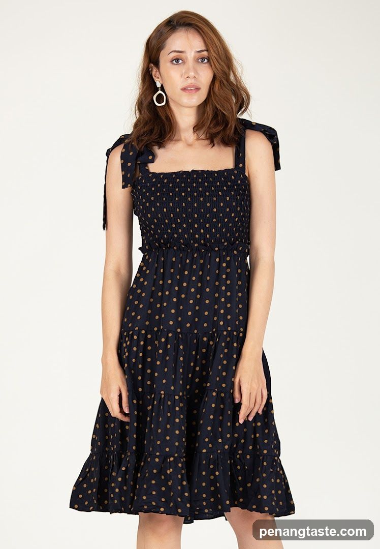 Model wearing polka dot dress