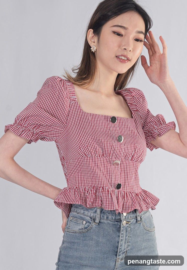 Model wearing red gingham blouse