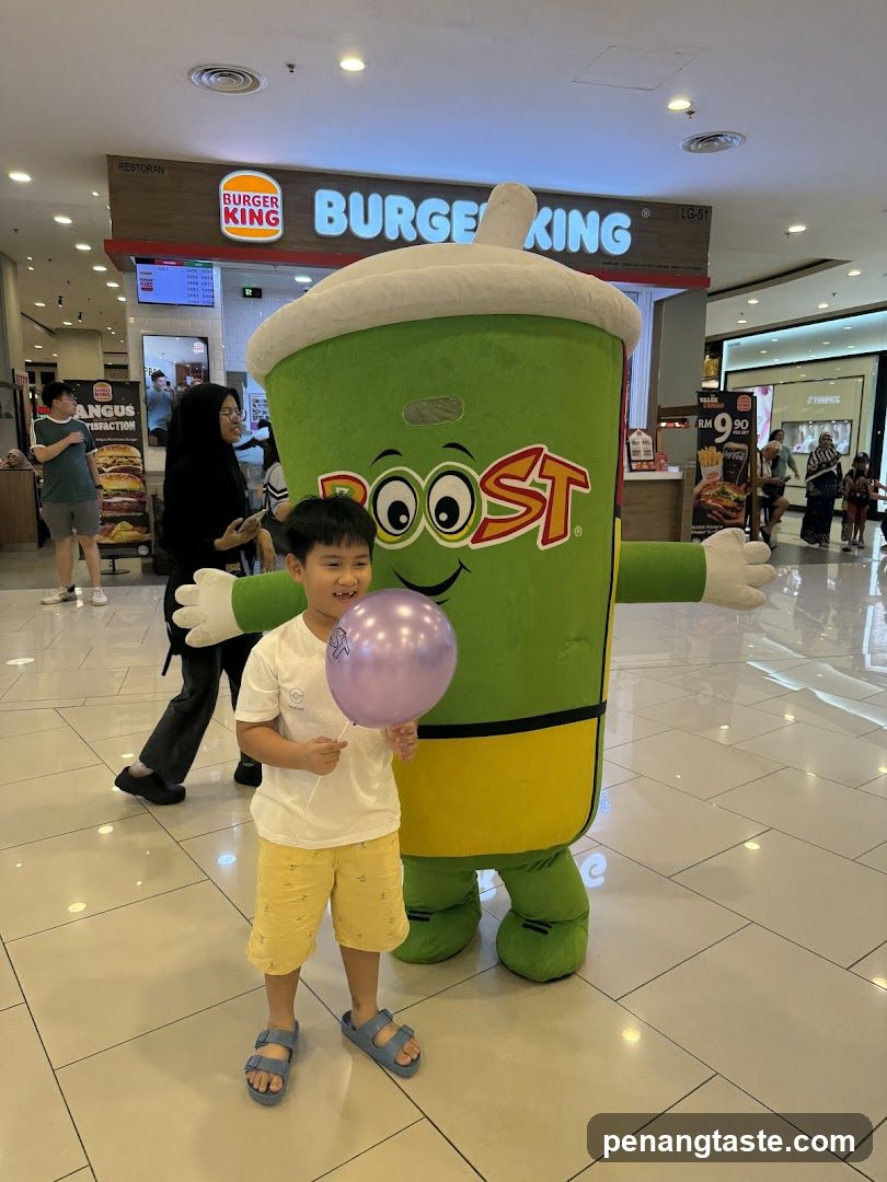 Child with Boost mascot in shopping mall