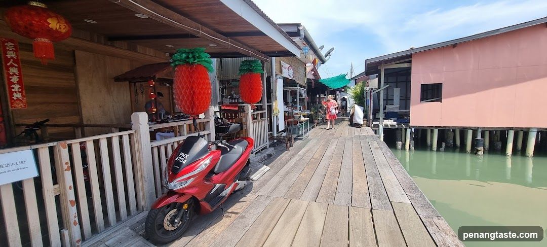 Wooden Boardwalk with Stilt Houses and Decorative Lanterns