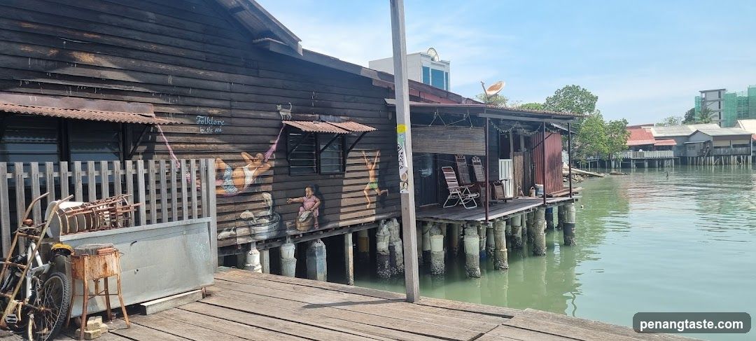 Waterfront wooden structure with murals