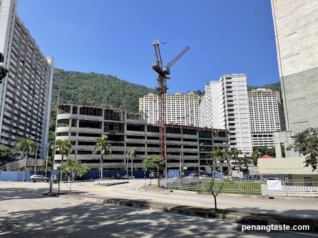 Urban construction site with cranes and high-rise buildings