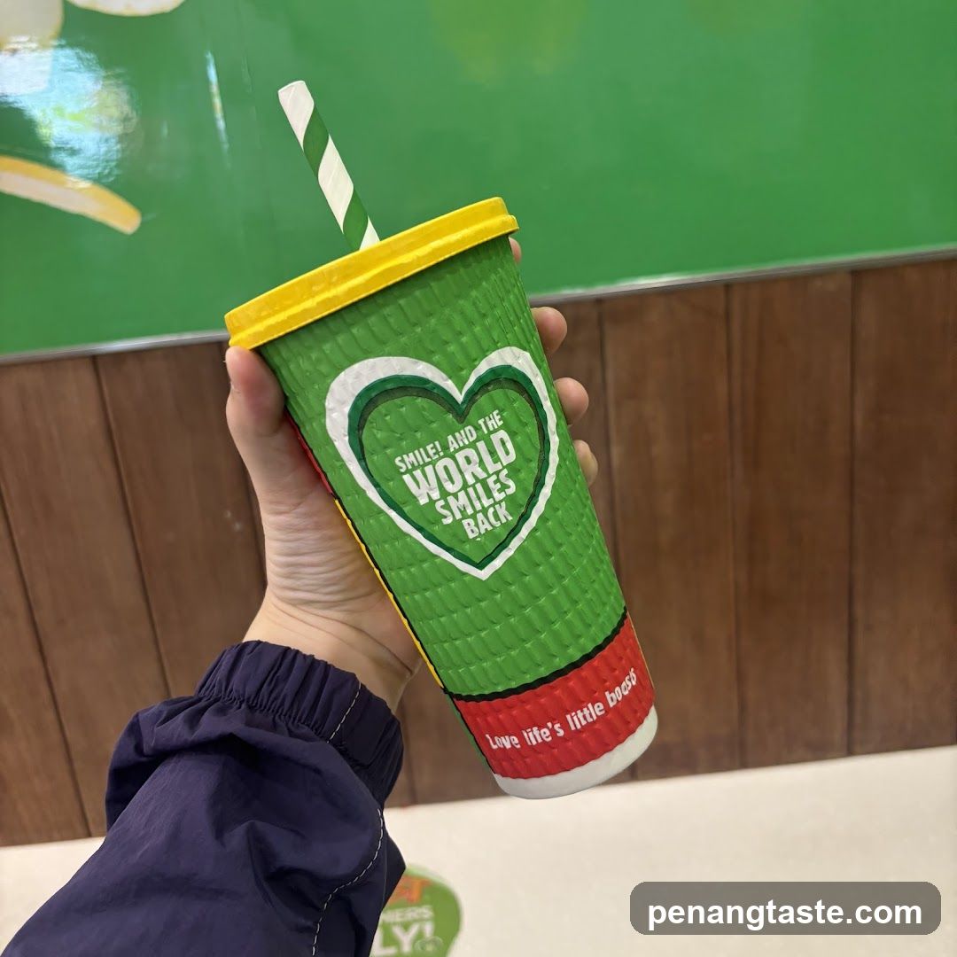 Hand holding branded cup