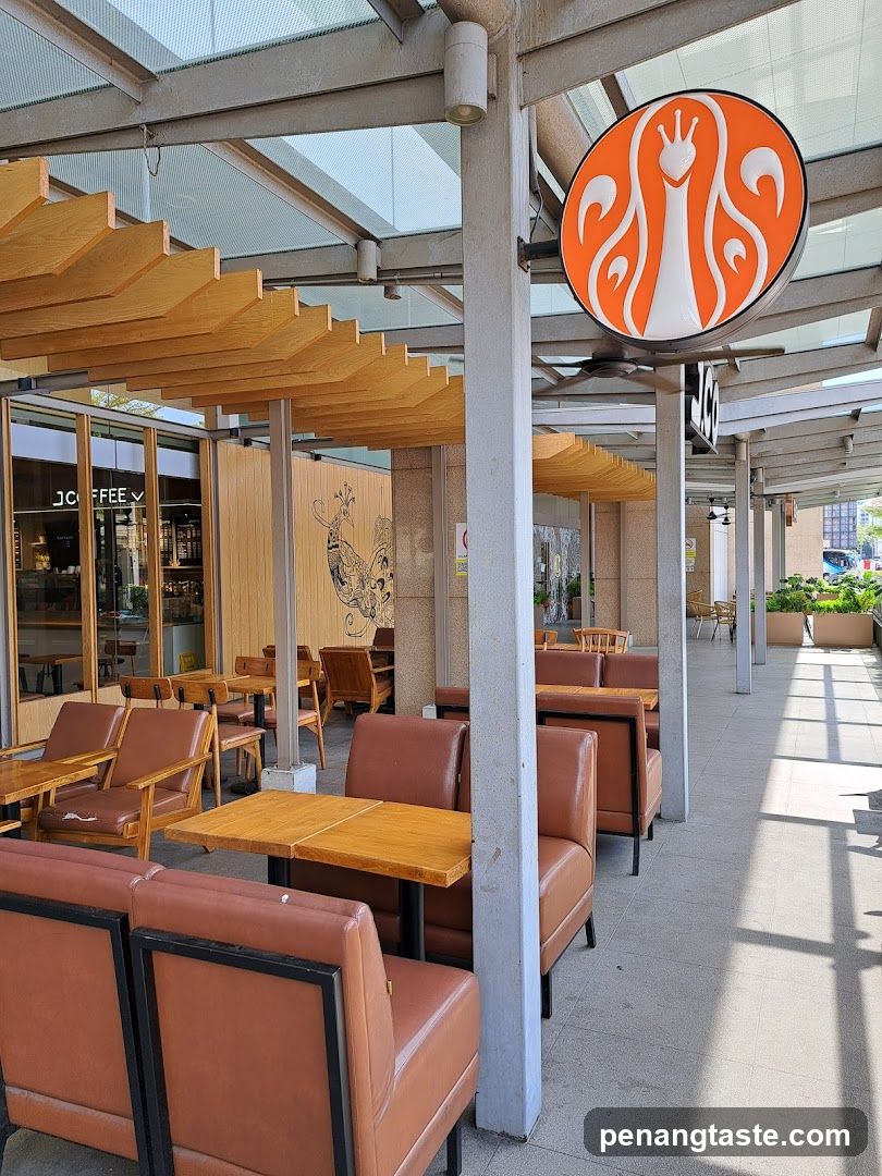Outdoor seating area with logo signage