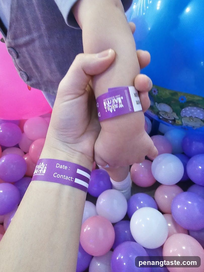Child's Hand in Ball Pool