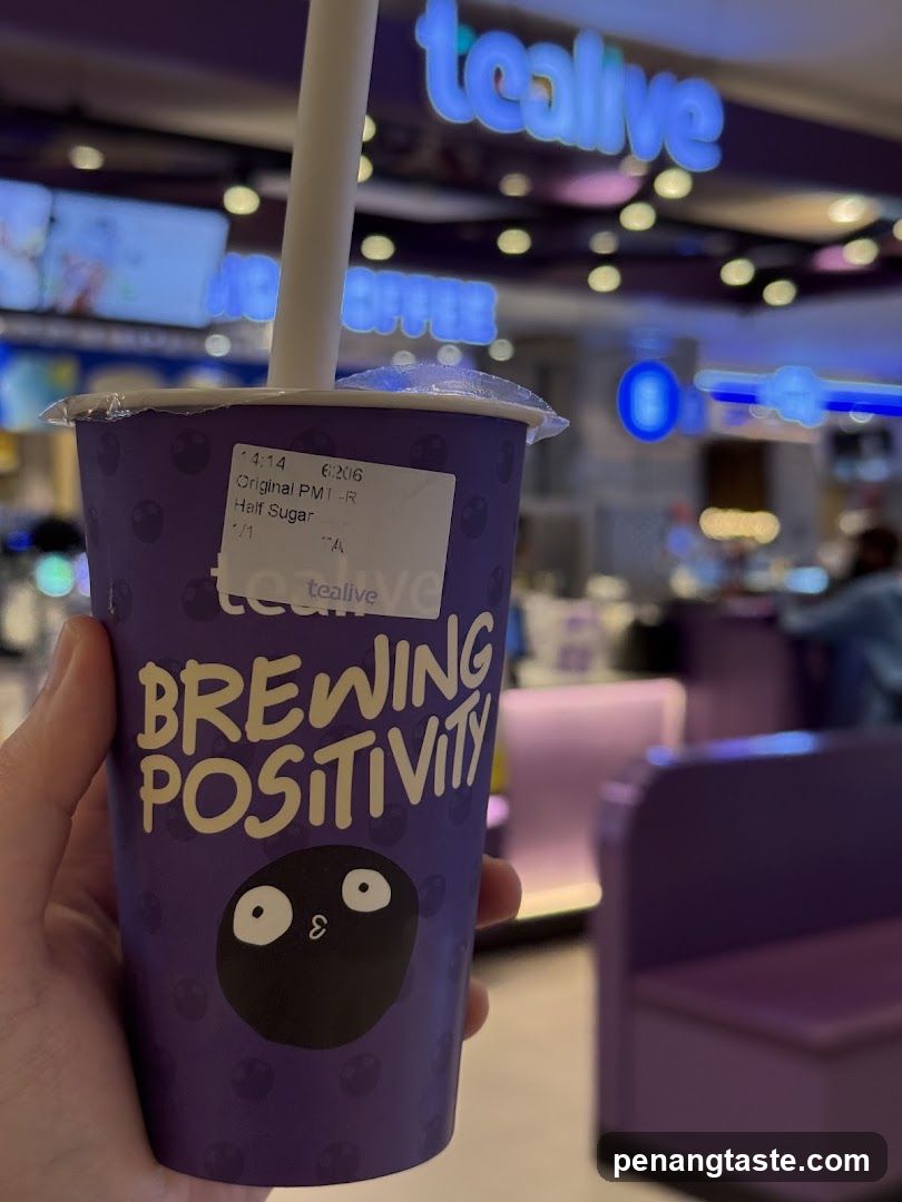 Tealife Beverage Cup Held in Hand