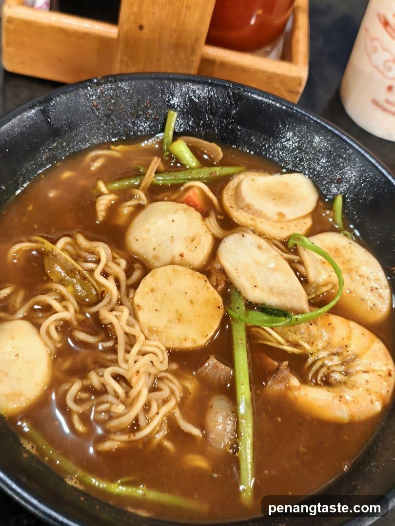 Noodle dish in black bowl